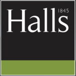 Charming red brick house with bay windows and a blue front door.