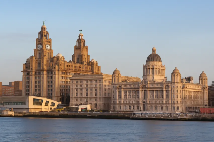 skyline of liverpool buildings along the river mersey