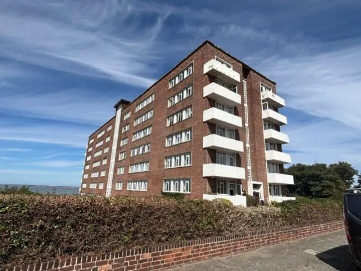 Brick-built apartment building with balconies and multiple floors