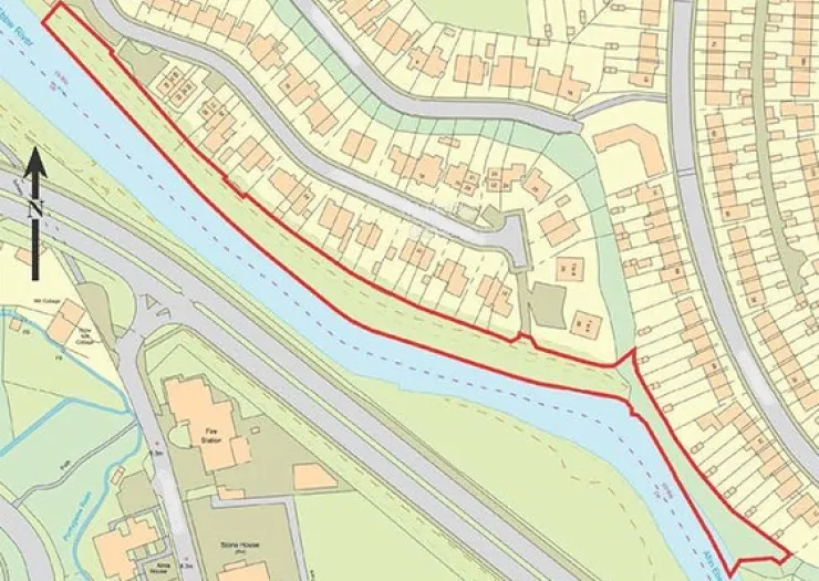 Map of Stowe River with red boundary line, adjacent roads, and residential properties.