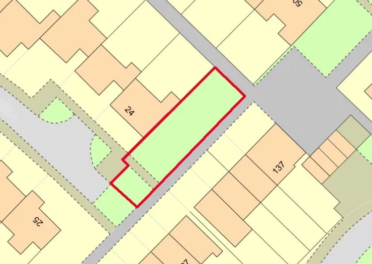 Plot map highlighting a green, rectangular area outlined in red. Surrounding plots and roads are also shown.