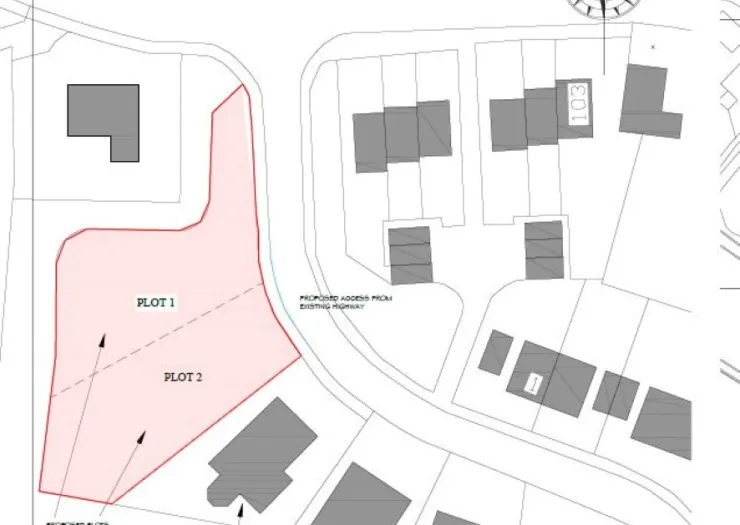 Plot map highlighting two available plots for development, accessed from existing highway.