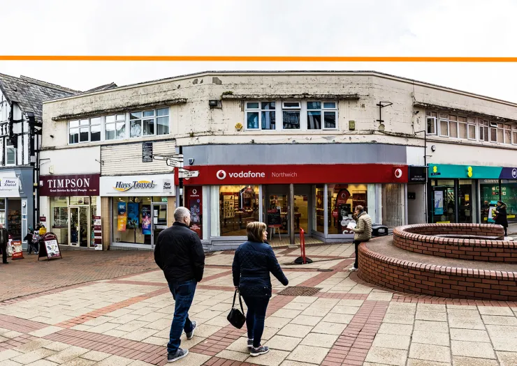 Vodafone store in Northwich town centre, with pedestrians and other retail units.