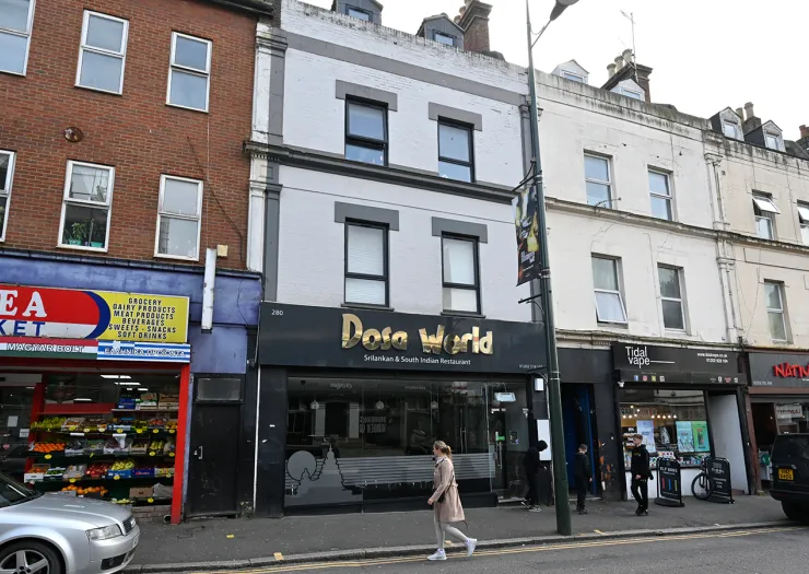 Dosa World" Sri Lankan & South Indian restaurant storefront on a UK high street.