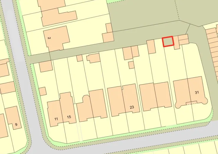 Simple street map with a red-outlined property highlighted.