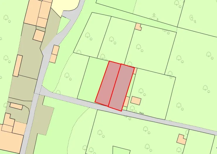 Highlighted red area on a property sitemap showing land boundaries and adjacent track.