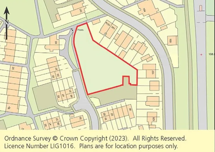 Ordnance Survey map highlighting a vacant plot outlined in red within a residential area.
