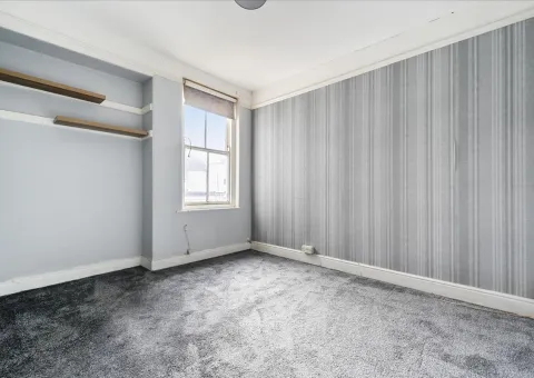 interior of bedroom with grey carpet