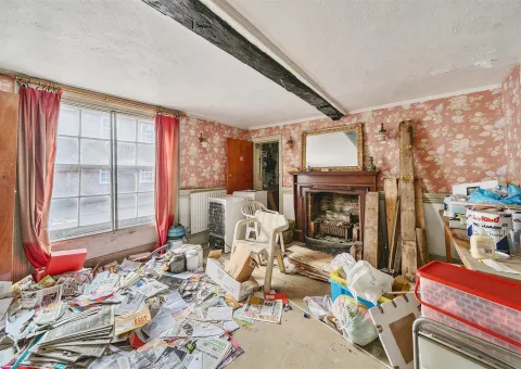 room with window and red curtain