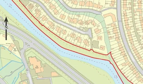 Map of Stowe River with red boundary line, adjacent roads, and residential properties.