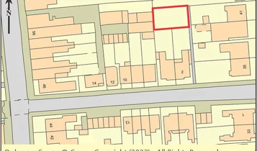 Ordnance Survey map highlighting a specific property plot outlined in red.