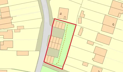 Property site map with buildings outlined in red.