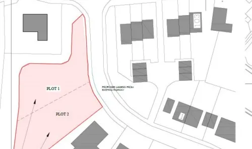 Plot map highlighting two available plots for development, accessed from existing highway.