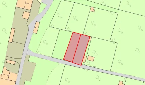Highlighted red area on a property sitemap showing land boundaries and adjacent track.