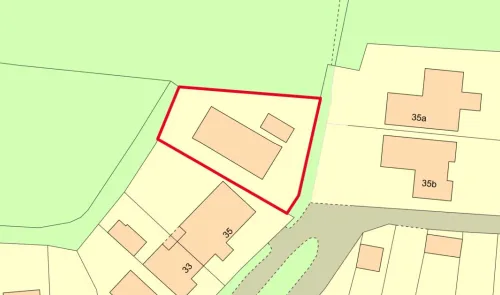 Property plat map highlighting a specific parcel in red outline.