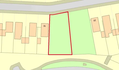 Map outlining a vacant greenfield plot with red borders, situated between properties numbered 18 and 20.
