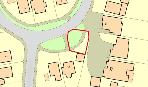Plot map highlighting a specific parcel of land outlined in red.