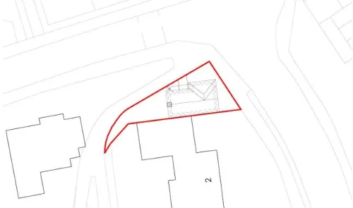 Property plat map with house outline highlighted in red.
