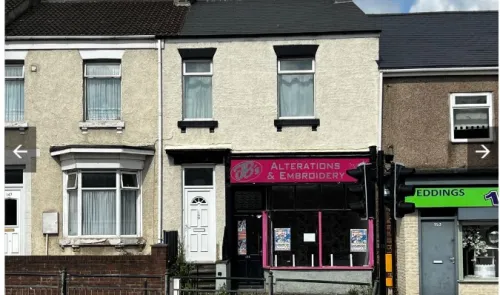 B's Alterations & Embroidery" storefront between two terraced houses.