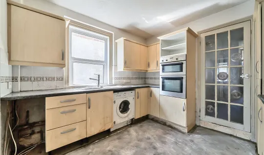 kitchen interior with sand colour units 